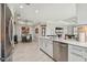 Spacious kitchen with an island, stainless steel appliances, and adjoining dining area at 10816 Wendover Dr, Palmetto, FL 34221