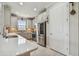 Well-lit kitchen featuring stainless steel appliances, tile backsplash, and ample counter space at 10816 Wendover Dr, Palmetto, FL 34221