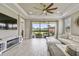 Spacious living area with access to the backyard featuring ample natural light at 10816 Wendover Dr, Palmetto, FL 34221