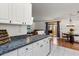 Open-concept kitchen and dining space with stainless steel appliances and a view of the Gathering room at 1108 16Th Nw Ave, Clearwater, FL 33756