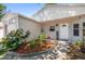 Close up of a home's entrance displaying a welcoming garden with decorative plants at 1108 16Th Nw Ave, Clearwater, FL 33756