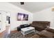 Inviting living room featuring modern decor, hardwood floors, ceiling fan, and a comfortable seating area at 1108 16Th Nw Ave, Clearwater, FL 33756