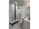 Renovated bathroom with stylish tile, a modern vanity, and a walk-in shower for a spa-like experience at 112 N Betty Ln, Clearwater, FL 33755