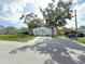 Charming single story home featuring mature trees and a large front yard at 112 N Betty Ln, Clearwater, FL 33755