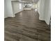Spacious living room featuring modern flooring and an open layout with easy access to the kitchen at 112 N Betty Ln, Clearwater, FL 33755