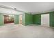 Spacious living room with large windows and neutral carpet flooring at 1340 Whispering Pines Dr, Clearwater, FL 33764