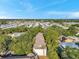 Aerial photograph showcasing the community nestled among mature trees and landscaping at 13777 Forest Lake Dr, Largo, FL 33771