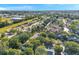 Aerial shot showcasing neighborhood homes surrounded by lush trees in a picturesque setting at 13777 Forest Lake Dr, Largo, FL 33771