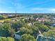 Aerial view of community featuring lush trees and manicured landscaping at 13777 Forest Lake Dr, Largo, FL 33771