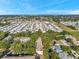Captured from above, this mobile home community boasts tidy residences arranged in orderly rows under a bright, sunny sky at 13777 Forest Lake Dr, Largo, FL 33771