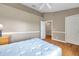 Bedroom featuring wood laminate floors, overhead light, and an entrance to a closet at 13777 Forest Lake Dr, Largo, FL 33771
