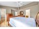 Bedroom with wood floors, large windows, and closet and bathroom access at 13777 Forest Lake Dr, Largo, FL 33771