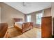 Bedroom with wood floors, ceiling fan, and windows bringing in plenty of natural light at 13777 Forest Lake Dr, Largo, FL 33771