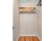 Walk-in closet with wood floors, door, and wire shelving for storage at 13777 Forest Lake Dr, Largo, FL 33771