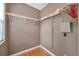 Walk-in closet with wood floors, wire shelving, and a window at 13777 Forest Lake Dr, Largo, FL 33771