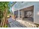 Back of home featuring dual screened in patios leading to a landscaped backyard at 13777 Forest Lake Dr, Largo, FL 33771