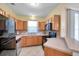 Efficient kitchen featuring sleek black appliances, wood cabinets, and functional countertops at 13777 Forest Lake Dr, Largo, FL 33771