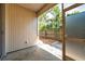The screened in patio leads to a small fenced in backyard with garden area, creating an inviting outdoor space at 13777 Forest Lake Dr, Largo, FL 33771