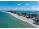Breathtaking aerial of beachfront condos showcasing white sandy beach and blue ocean waters at 1480 Gulf Blvd # 103, Clearwater Beach, FL 33767