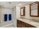 Stylish bathroom with double sinks, granite countertops, and modern fixtures at 1480 Gulf Blvd # 103, Clearwater Beach, FL 33767
