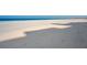 White sandy beach, clear water, and blue skies at 1480 Gulf Blvd # 103, Clearwater Beach, FL 33767