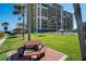 Beautiful community grounds feature picnic tables and lush landscaping, perfect for outdoor gatherings at 1480 Gulf Blvd # 103, Clearwater Beach, FL 33767