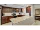 Well-equipped kitchen with granite countertops, stainless steel appliances, and dark wood cabinetry at 1480 Gulf Blvd # 103, Clearwater Beach, FL 33767