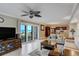 Inviting living space with an open floor plan to a kitchen and sliding doors with beach views at 1480 Gulf Blvd # 103, Clearwater Beach, FL 33767