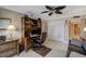 Office space featuring a ceiling fan, desk with computer, and a storage closet at 1480 Gulf Blvd # 103, Clearwater Beach, FL 33767