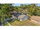 View of backyard showing the home's architecture and landscaping, perfect for outdoor activities at 15118 Brushwood Dr, Tampa, FL 33624