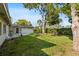 Lush backyard with mature trees offering shade and tranquility, ideal for relaxation and recreation at 15118 Brushwood Dr, Tampa, FL 33624