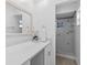 This bathroom features a quartz countertop and tiled shower with glass door at 15118 Brushwood Dr, Tampa, FL 33624