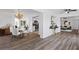 Open-concept dining area with a modern table set, seamlessly connected to the kitchen and living space at 15118 Brushwood Dr, Tampa, FL 33624