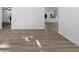 Open-concept living area featuring modern gray-toned floors and abundant natural light at 15118 Brushwood Dr, Tampa, FL 33624