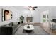 Staged living room with fireplace, decor and modern gray-toned floor at 15118 Brushwood Dr, Tampa, FL 33624