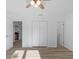 Brightly lit bedroom has wood-look floors and a ceiling fan at 15118 Brushwood Dr, Tampa, FL 33624