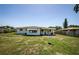 A view of back yard with patio extending from rear of house at 1524 Lemon St, Clearwater, FL 33756