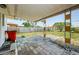 Backyard patio with pavers, fence, and a green lawn with a tree at 1524 Lemon St, Clearwater, FL 33756