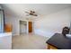 Bedroom with a ceiling fan, closet and terrazzo flooring in a home at 1524 Lemon St, Clearwater, FL 33756
