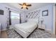 Bright bedroom with a queen-sized bed, ceiling fan, patterned rug and light blue colored walls at 1524 Lemon St, Clearwater, FL 33756