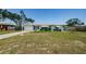Expansive lawn complements this inviting single-story home, promising ample outdoor space at 1524 Lemon St, Clearwater, FL 33756