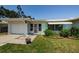 Charming single-story home featuring a well-maintained lawn and inviting curb appeal at 1524 Lemon St, Clearwater, FL 33756