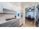 Efficient kitchen layout with essential appliances, and convenient access to the adjacent dining area at 1524 Lemon St, Clearwater, FL 33756