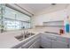 Functional kitchen featuring ample counter space and a window with a backyard view at 1524 Lemon St, Clearwater, FL 33756