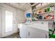 Functional laundry room featuring modern appliances and ample storage space at 1524 Lemon St, Clearwater, FL 33756