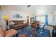 Cozy living room featuring comfortable seating and plenty of natural light from the large windows at 1524 Lemon St, Clearwater, FL 33756