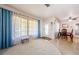 Bright living room with a cozy rug, dining area, and front door that allows ample natural light at 1524 Lemon St, Clearwater, FL 33756