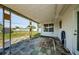 Covered patio with a block paver floor and a view of the backyard and fencing at 1524 Lemon St, Clearwater, FL 33756