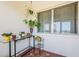 Bright sun room with views of the lush surroundings from the large window at 1524 Lemon St, Clearwater, FL 33756