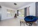 Bright sunroom featuring two large windows with backyard views, perfect for relaxing with ample natural light at 1524 Lemon St, Clearwater, FL 33756